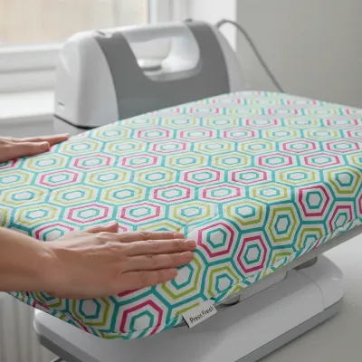 Person installing a new ironing press cover